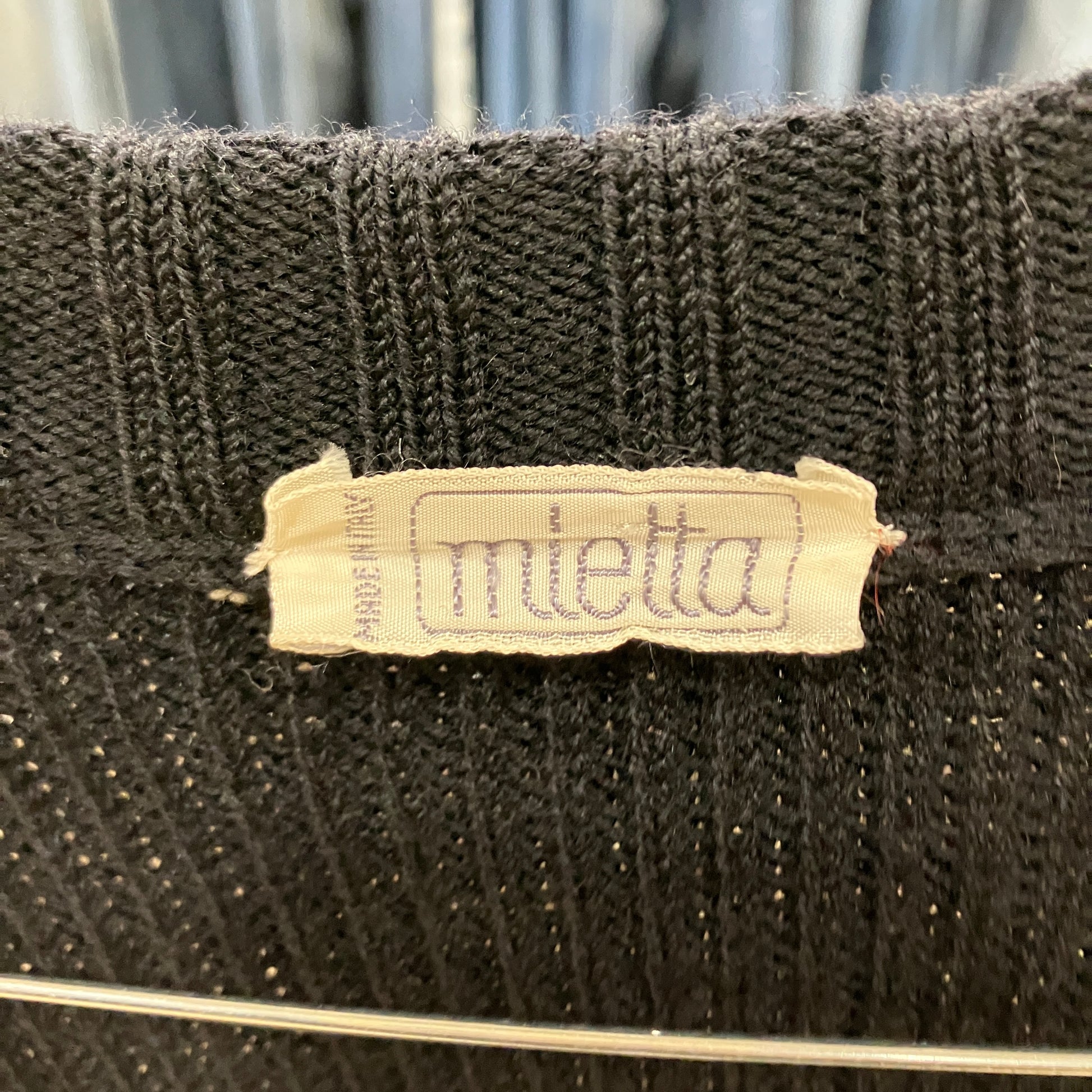 Textile product with 'miletta' label on a textured background