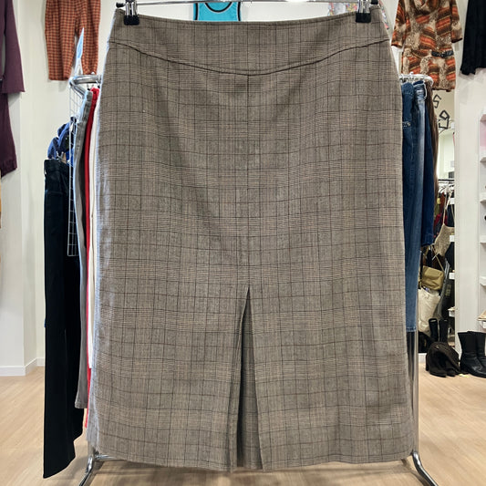 Plaid skirt on a hanger in a clothing store