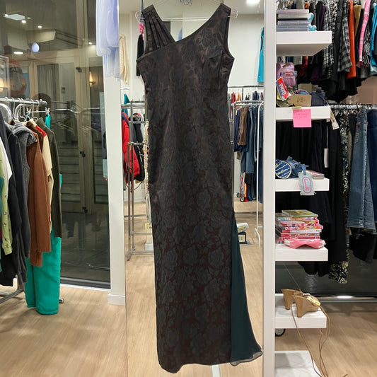 Black floral-patterned dress on a rack in a clothing store