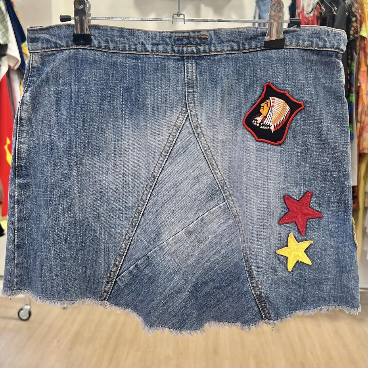 Denim skirt with patches on a rack