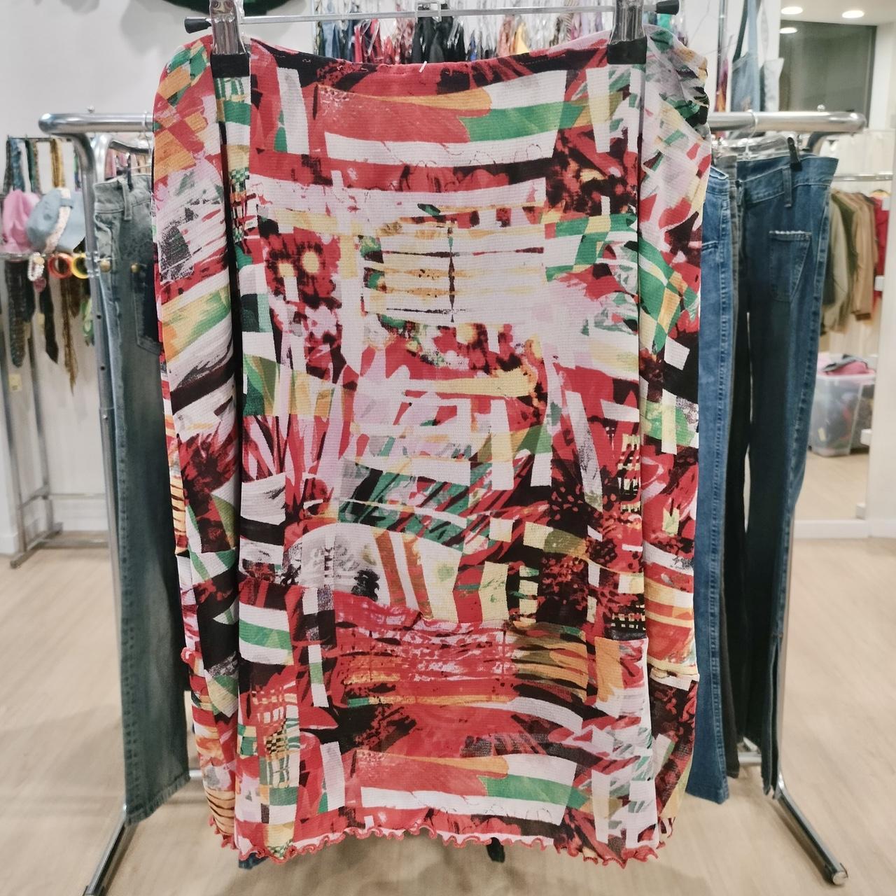 Colorful abstract print skirt on hanger in second hand fashion store