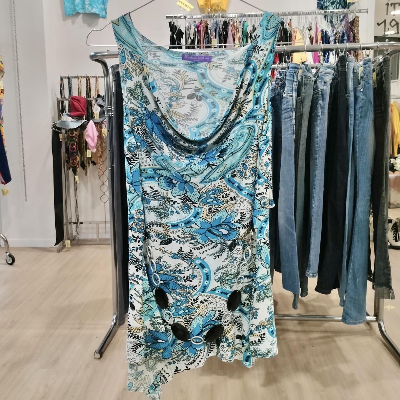 Floral dress hanging on a rack in a clothing store