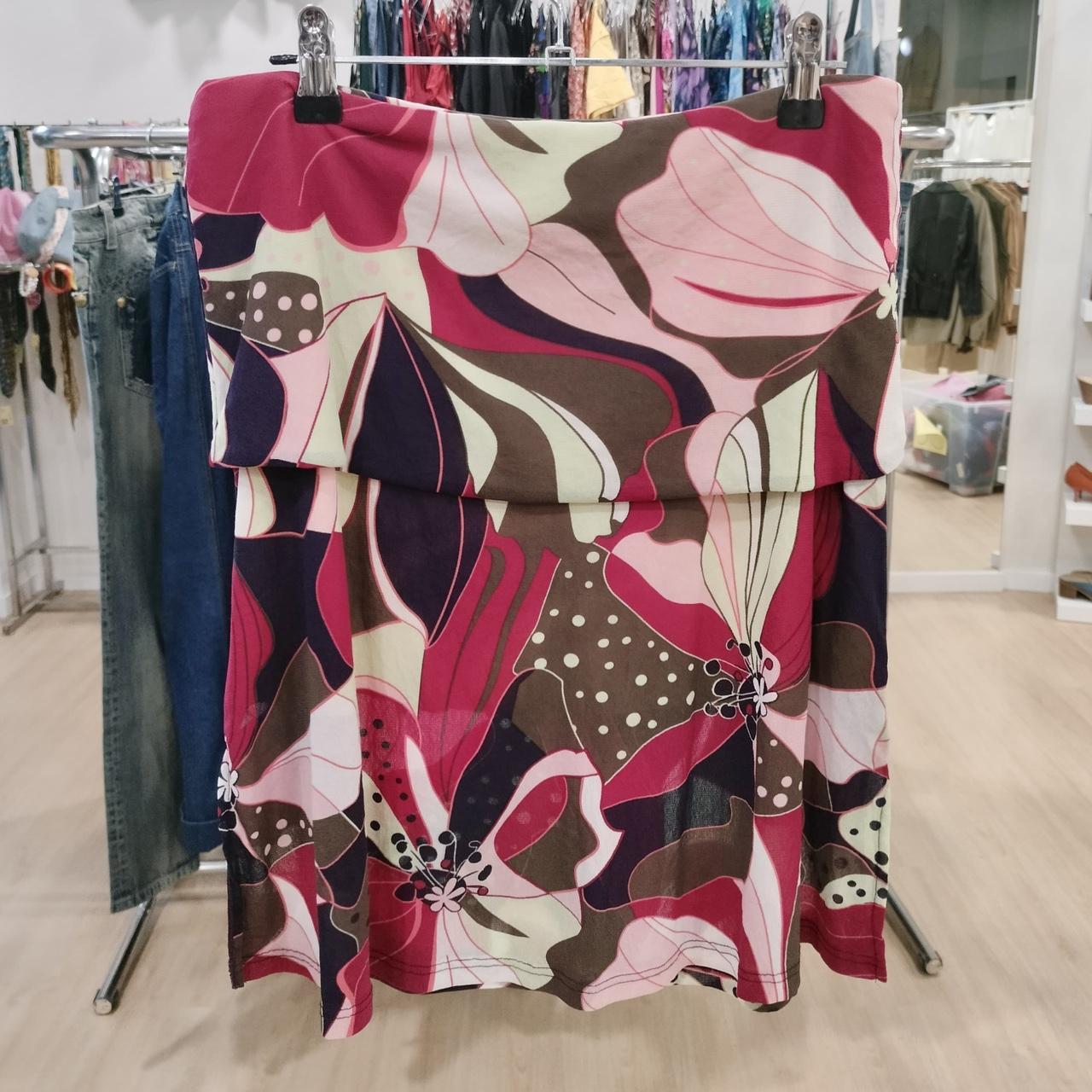Floral patterned skirt on a rack in a store setting
