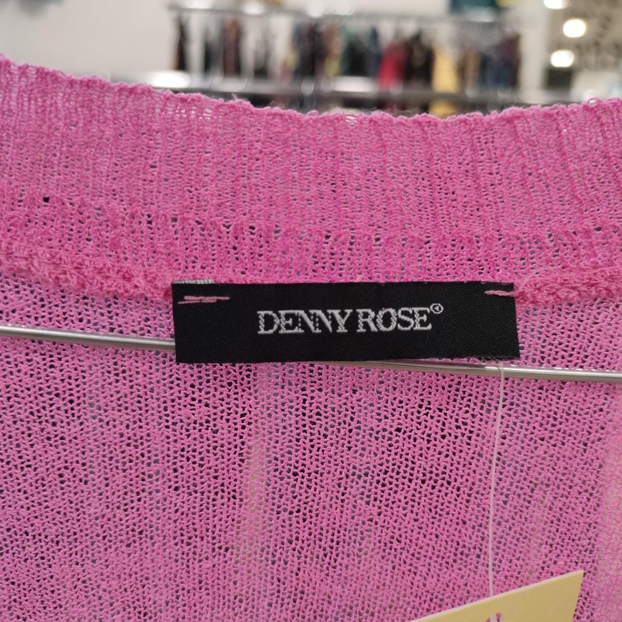 Close-up of a pink fabric with a 'Denny Rose' label