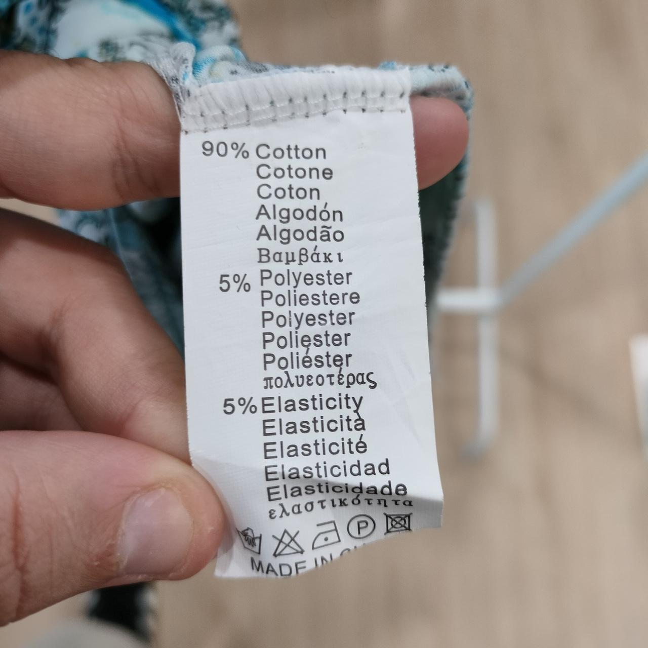 Close-up of a fabric label with text on a blurred background