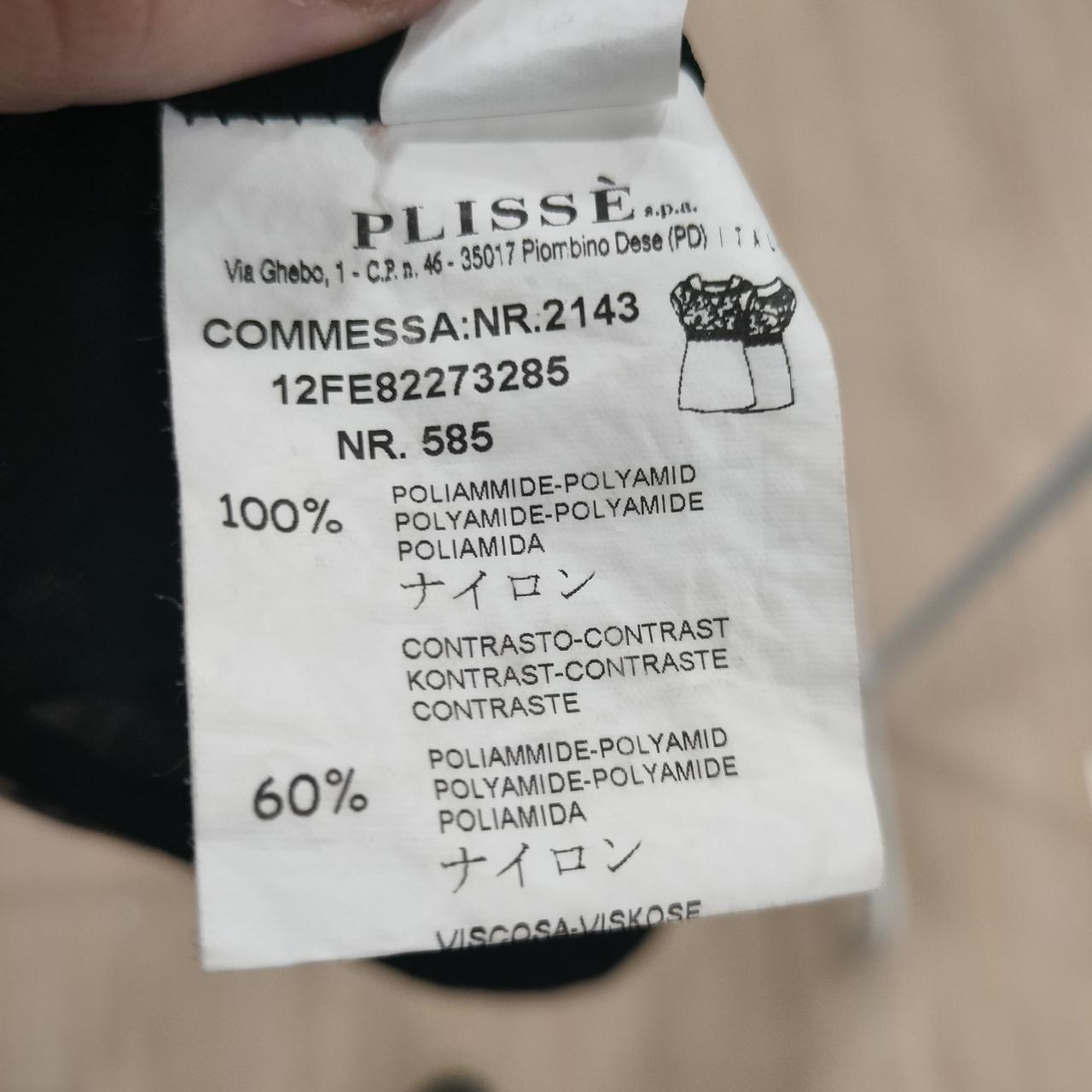 Clothing label with text and product details on a garment