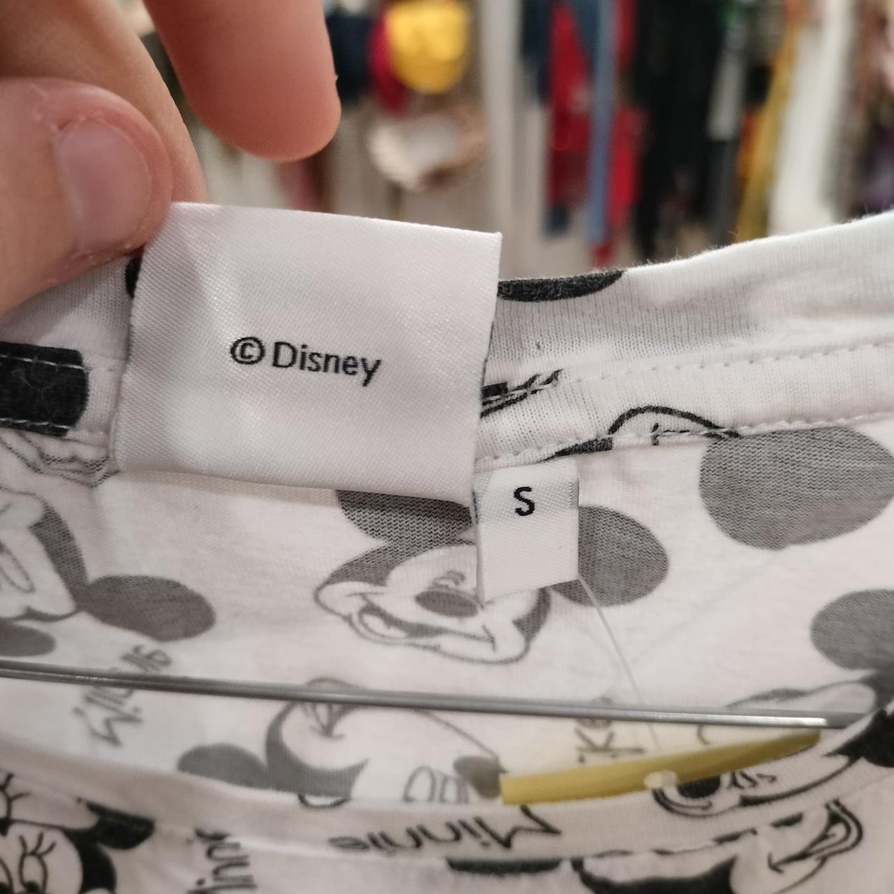 White Disney-licensed clothing with Minnie Mouse print, size S tag visible