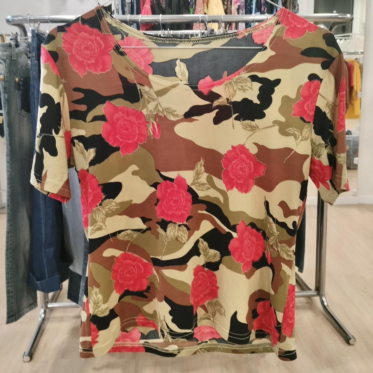 Short sleeve t-shirt with beige, brown, and black camouflage and red floral print