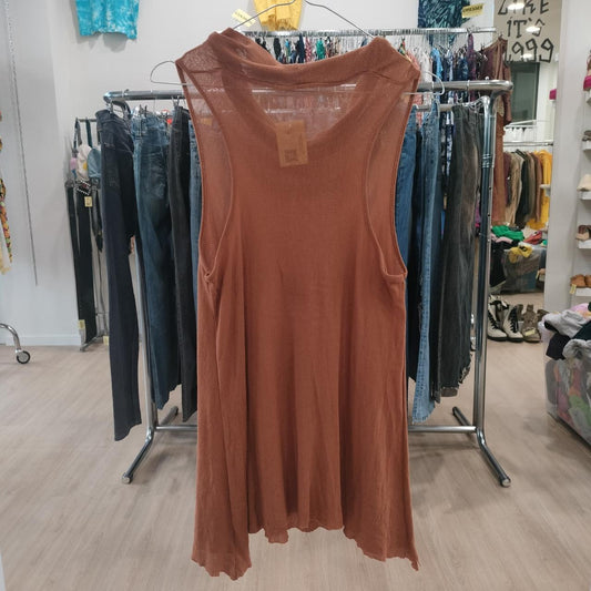 Sleeveless rust-brown flowy tank top hanging in a second hand clothing store