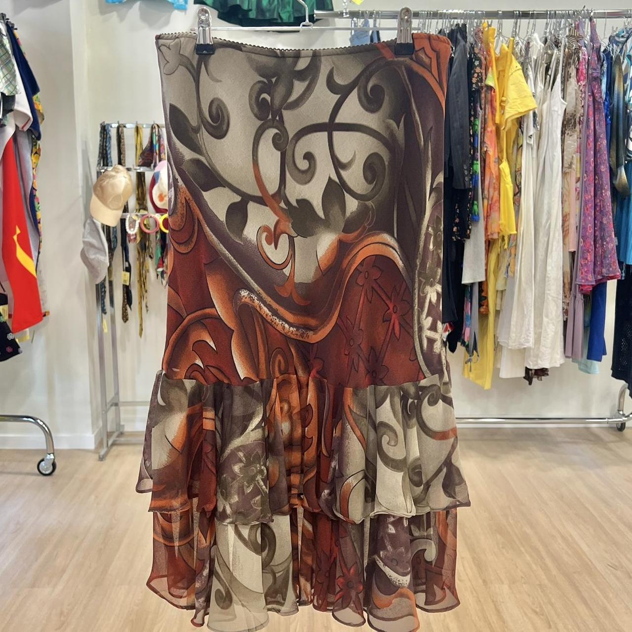 Patterned skirt hanging on a rack in a clothing store