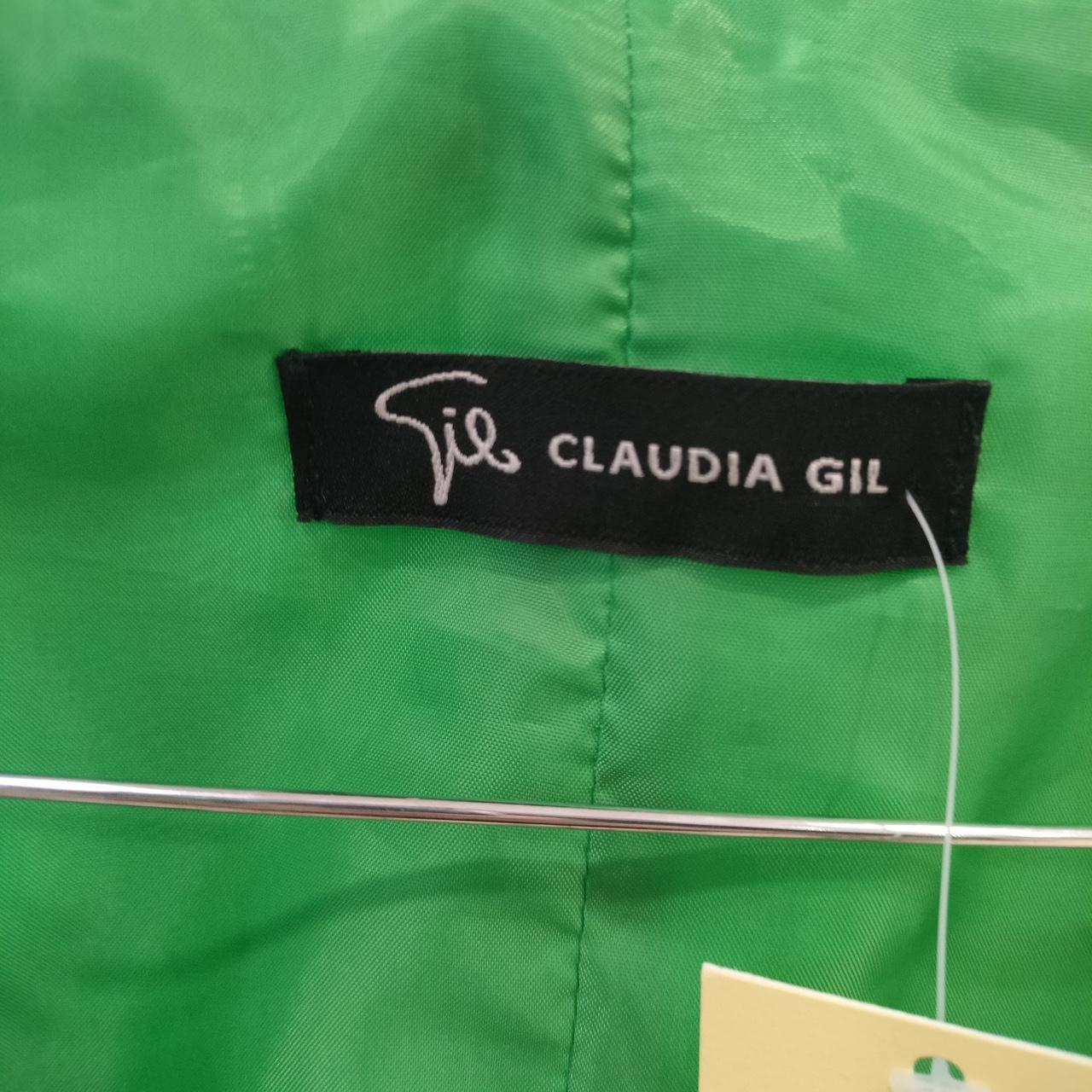 Green fabric with a Claudia Gil label