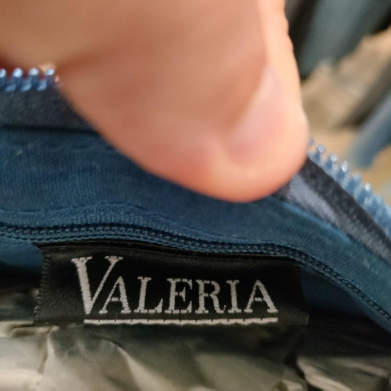 Close-up of a 'VALERIA' label on a piece of clothing