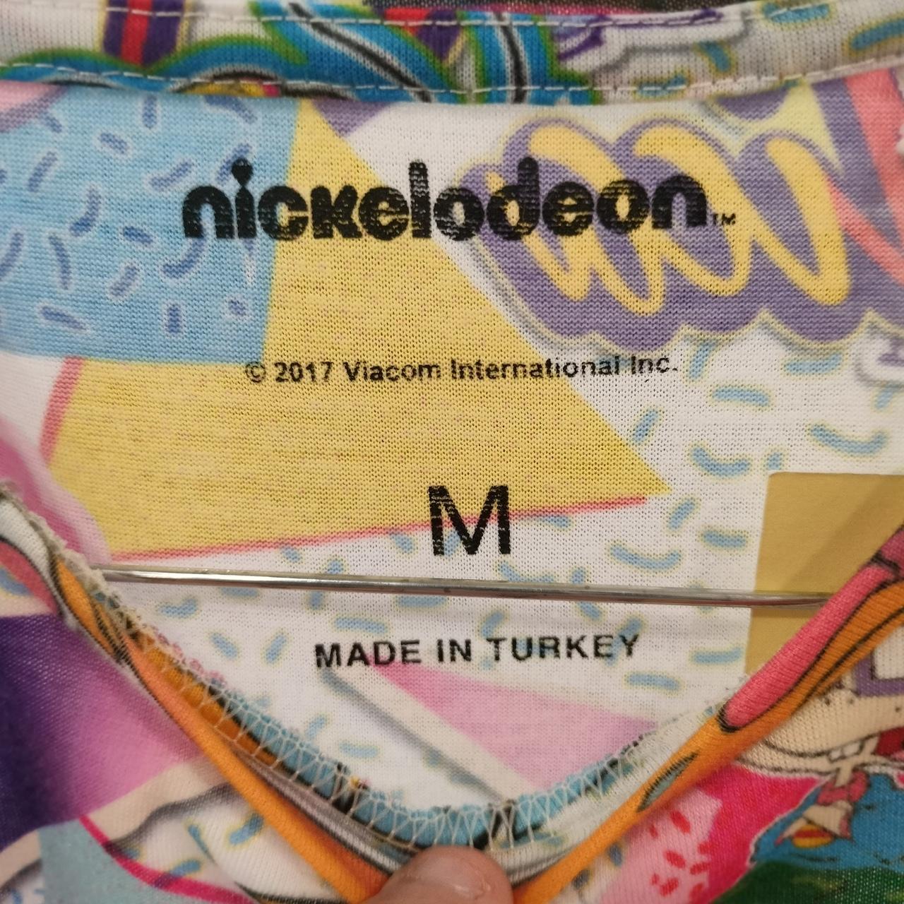 Colorful fabric with Nickelodeon branding and 'Made in Turkey' label