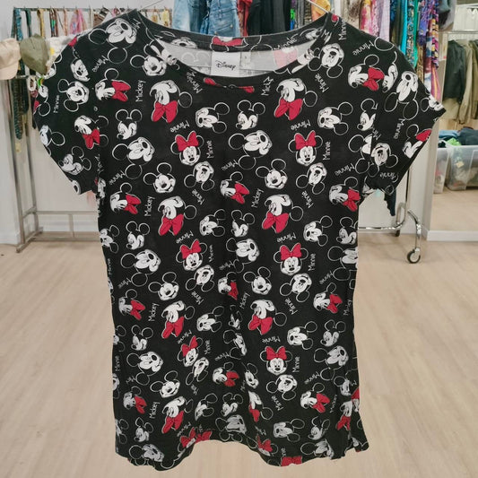 Black Disney t-shirt with Mickey and Minnie Mouse faces, red bows, displayed in thrift store