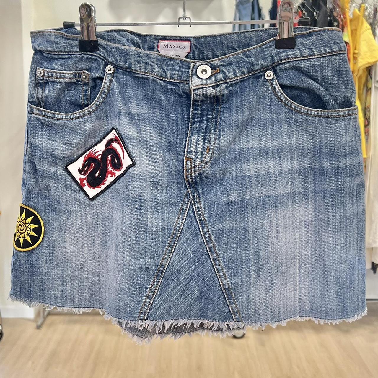 Denim skirt with patches on a rack