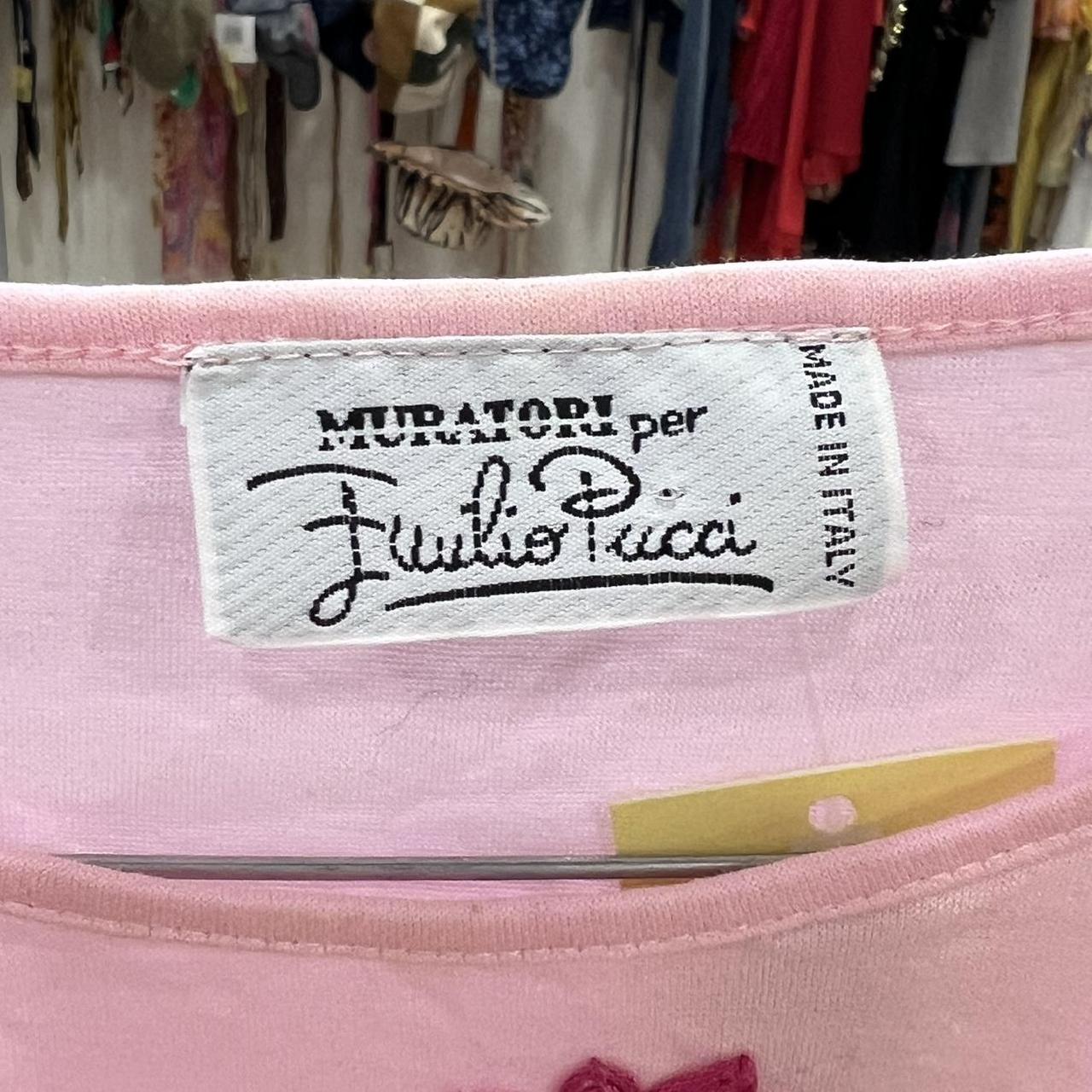 Pink fabric with a label featuring 'Muratori per Emilio Pucci' and 'Made in Italy'