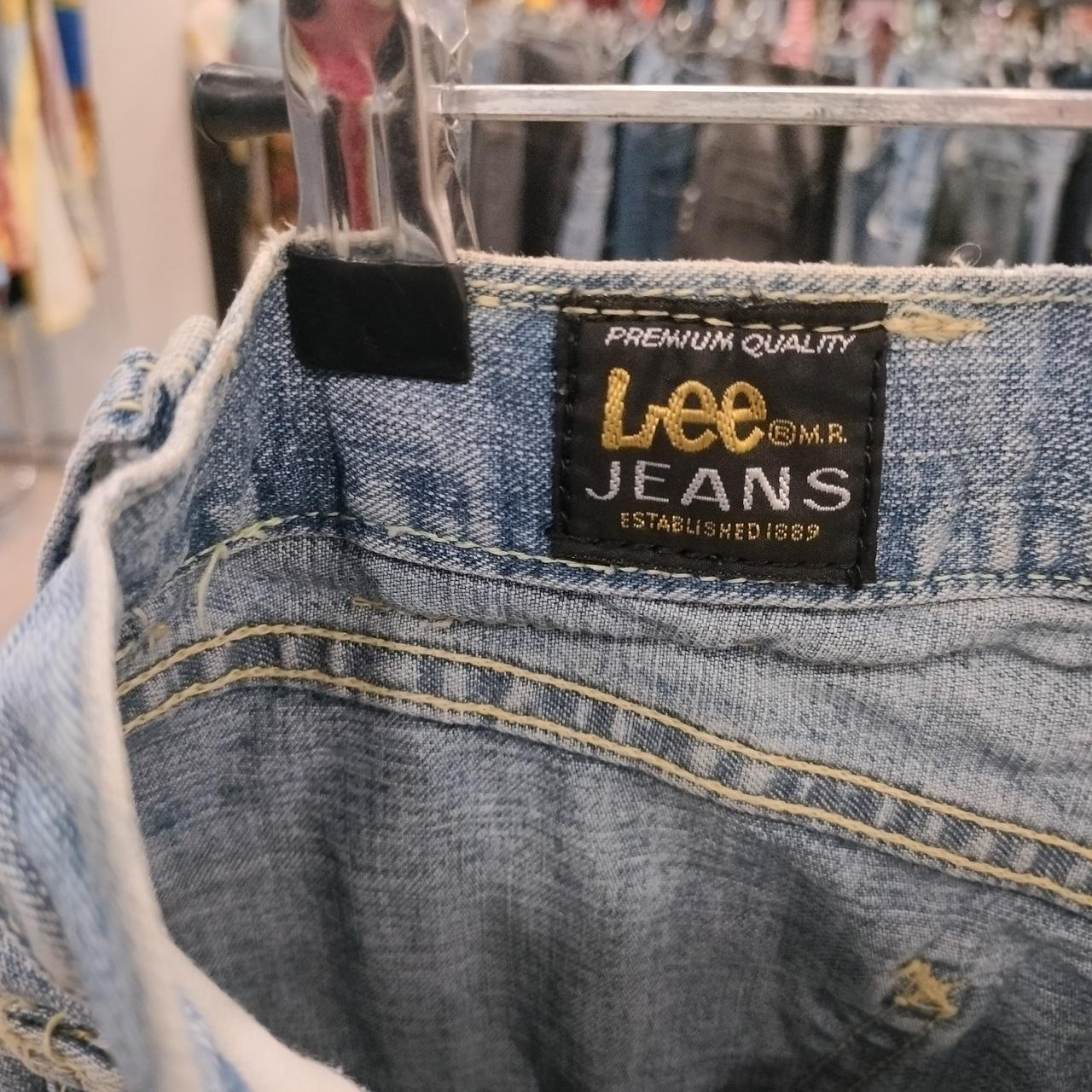Lee jeans label on a denim product with a blurred store background