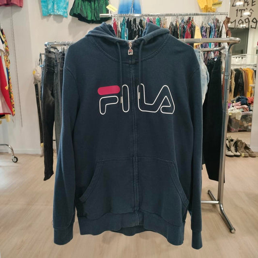 Navy blue hoodie with Fila logo in a store setting