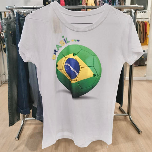 White t-shirt with Brasil soccer ball graphic and colored hearts, displayed in a clothing store