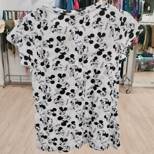 White t-shirt with black Mickey and Minnie Mouse print, displayed in second hand clothing store