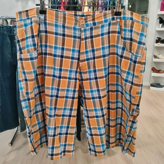 Orange blue plaid cotton shorts with pockets, displayed in a second hand fashion store