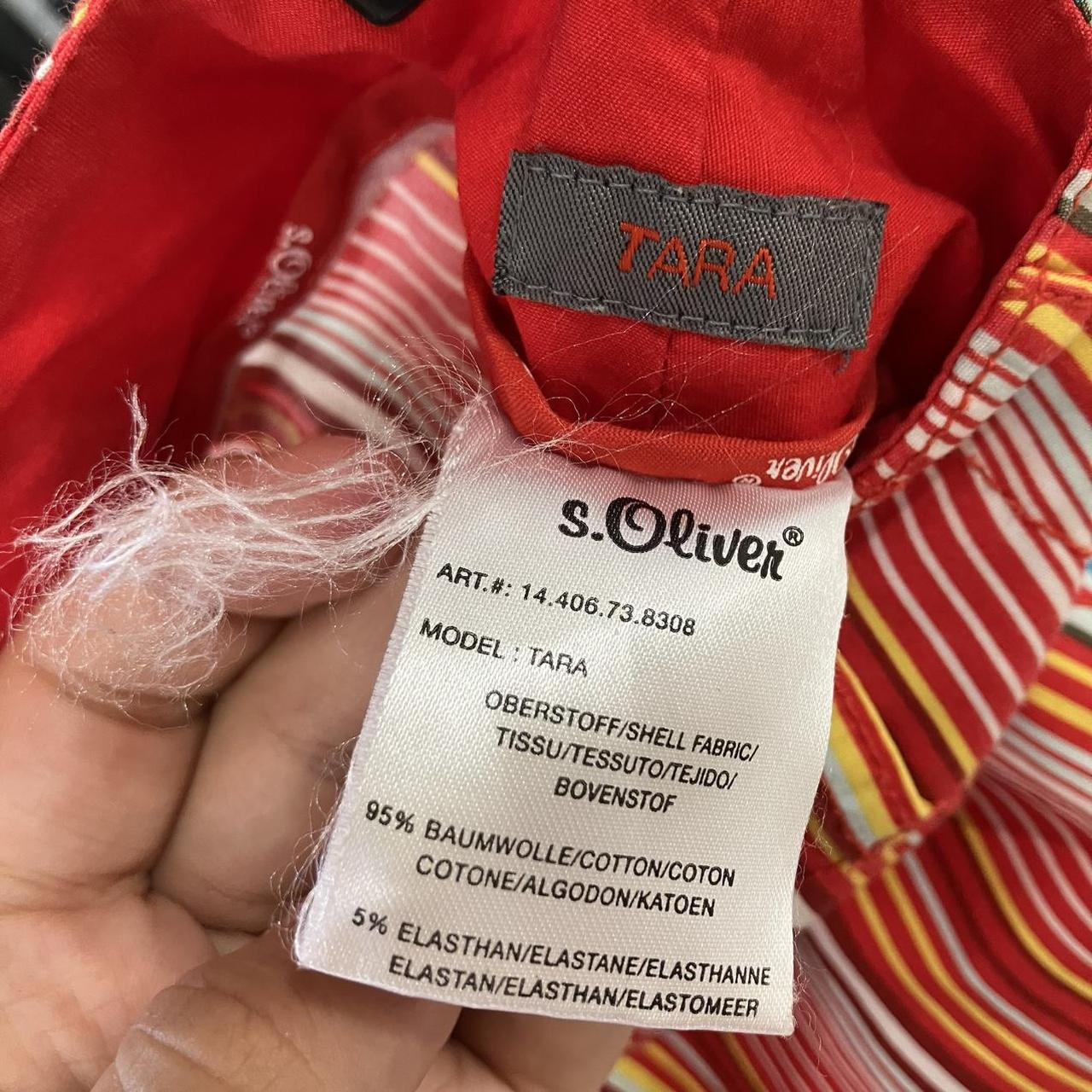 Close-up of s.Oliver red striped clothing label showing cotton elastane fabric details