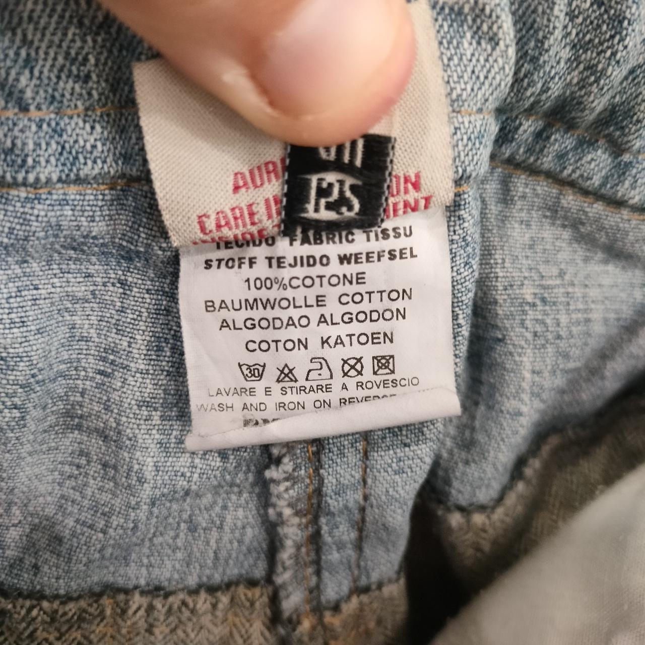 Close-up of a clothing label on denim fabric