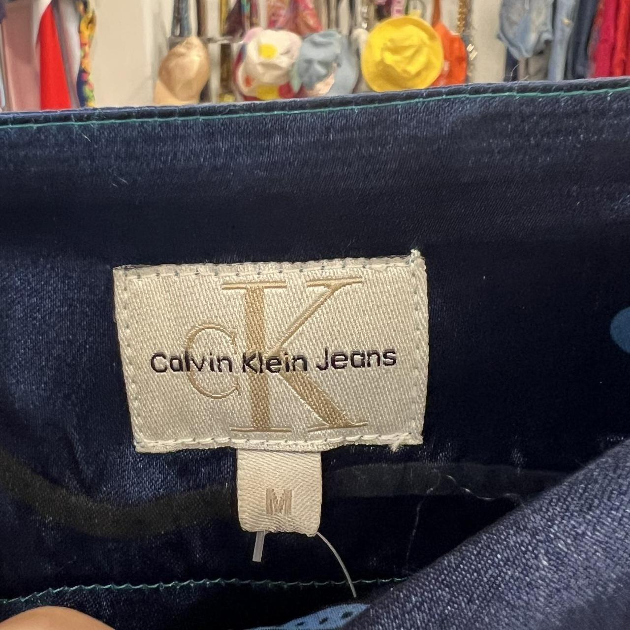 Calvin Klein Jeans label on a denim fabric background