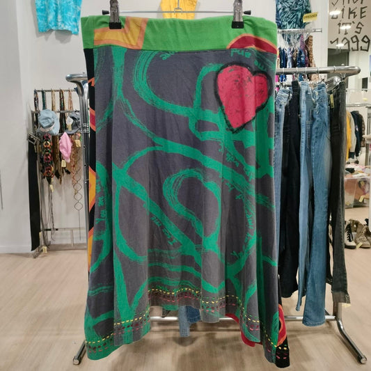 Colorful patterned skirt hanging on a rack in a store setting