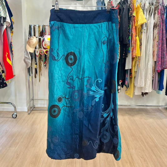 Blue floral-patterned skirt hanging on a rack in a store