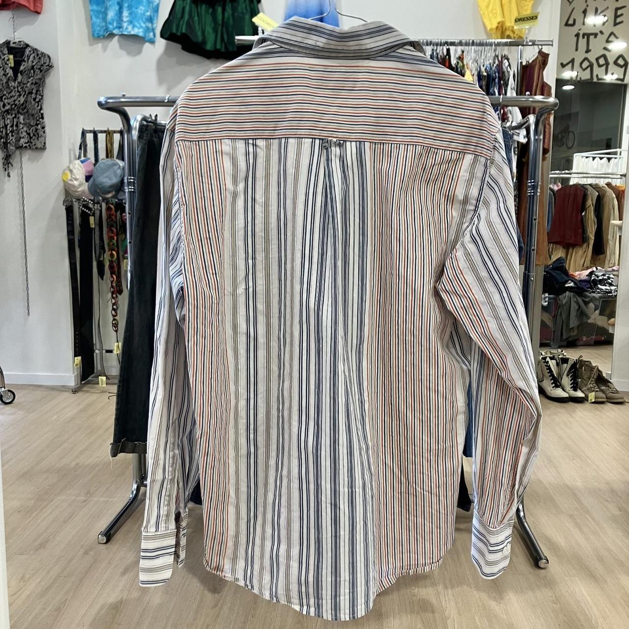 Striped shirt on a rack in a clothing store