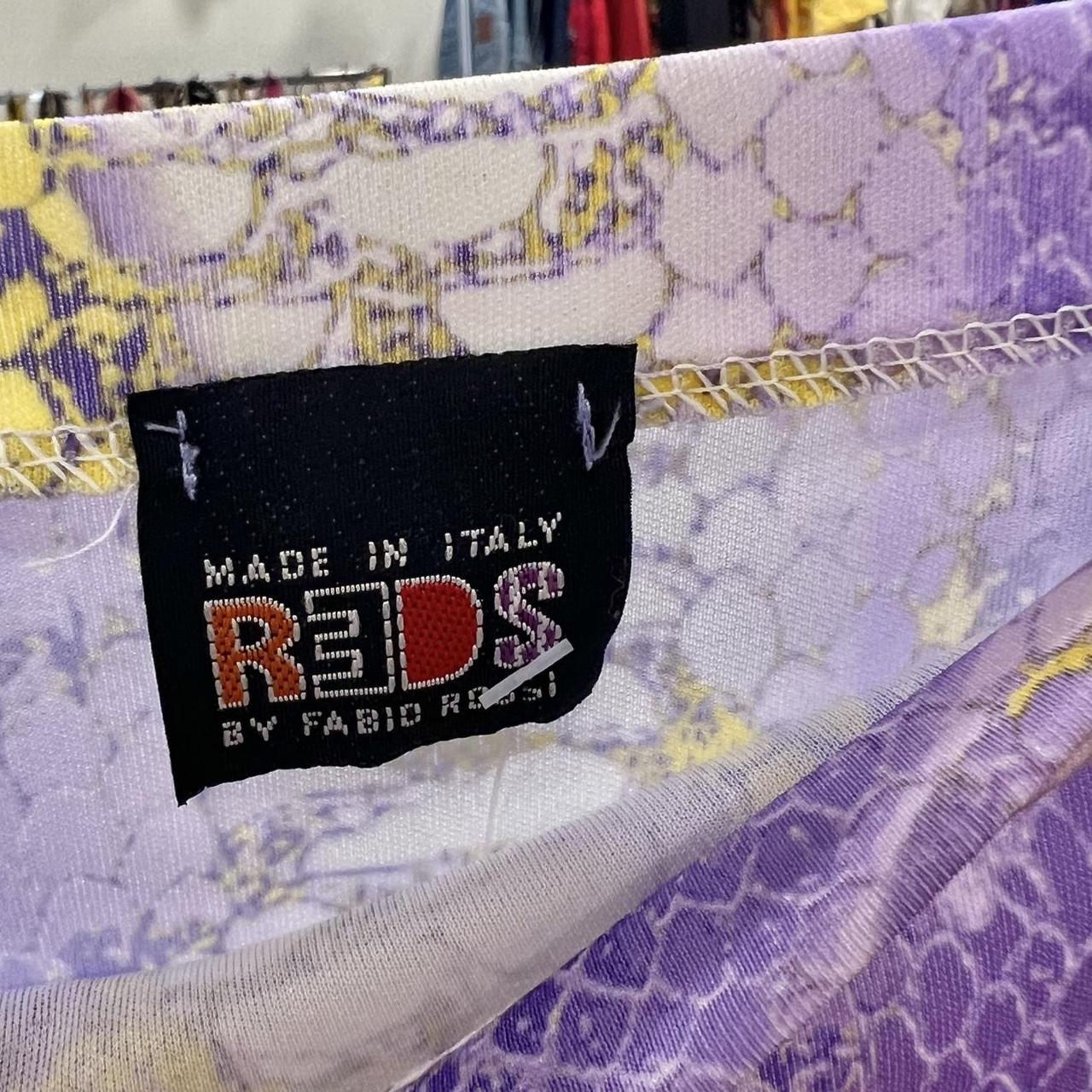 Fabric with a 'Made in Italy' label featuring the brand 'REDS by Fabio Rossi'
